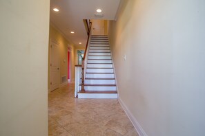 Stairs lead to additional rooms in this spacious interior.