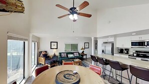 A modern kitchen with a dining area, a ceiling fan, and a view of the city. - Mountain Hideaway - Hot Tub, 3 Living Areas, 5 min. to Shop/Ski (Park City)