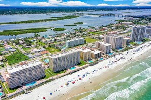 A coastal hotel with multiple high-rise buildings, a beachfront, and a marina. - Amazing Ocean & River Views - 2BR Condo (Daytona Beach)