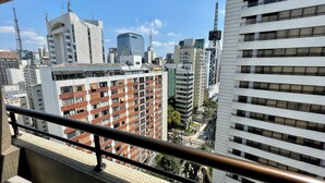 A cityscape with high-rise buildings, including a mix of modern and older architectural styles. - Três de Julho Flats - Paulista (São Paulo)