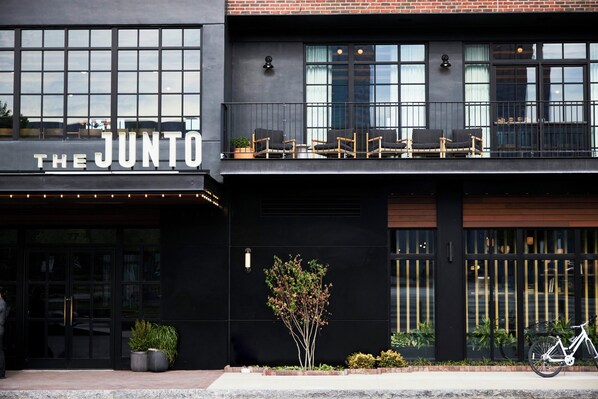A building with a sign reading 'THE JUNTO'.