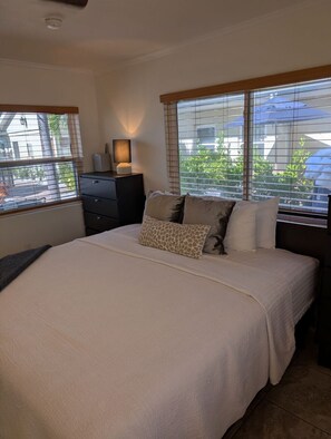 1 bedroom, desk, iron/ironing board, travel crib