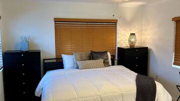 1 bedroom, desk, iron/ironing board, travel crib