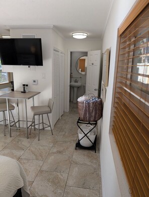 1 bedroom, desk, iron/ironing board, travel crib