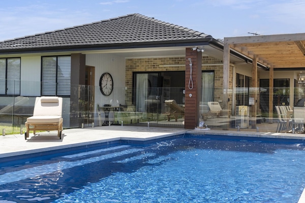 Resort style in ground solar-heated swimming pool