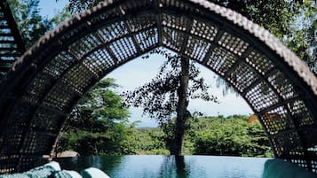 2 outdoor pools, open 7:00 AM to 8:00 PM, pool loungers