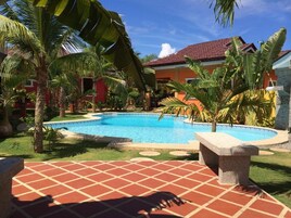 Outdoor pool, open 7:00 AM to 10:00 PM, sun loungers