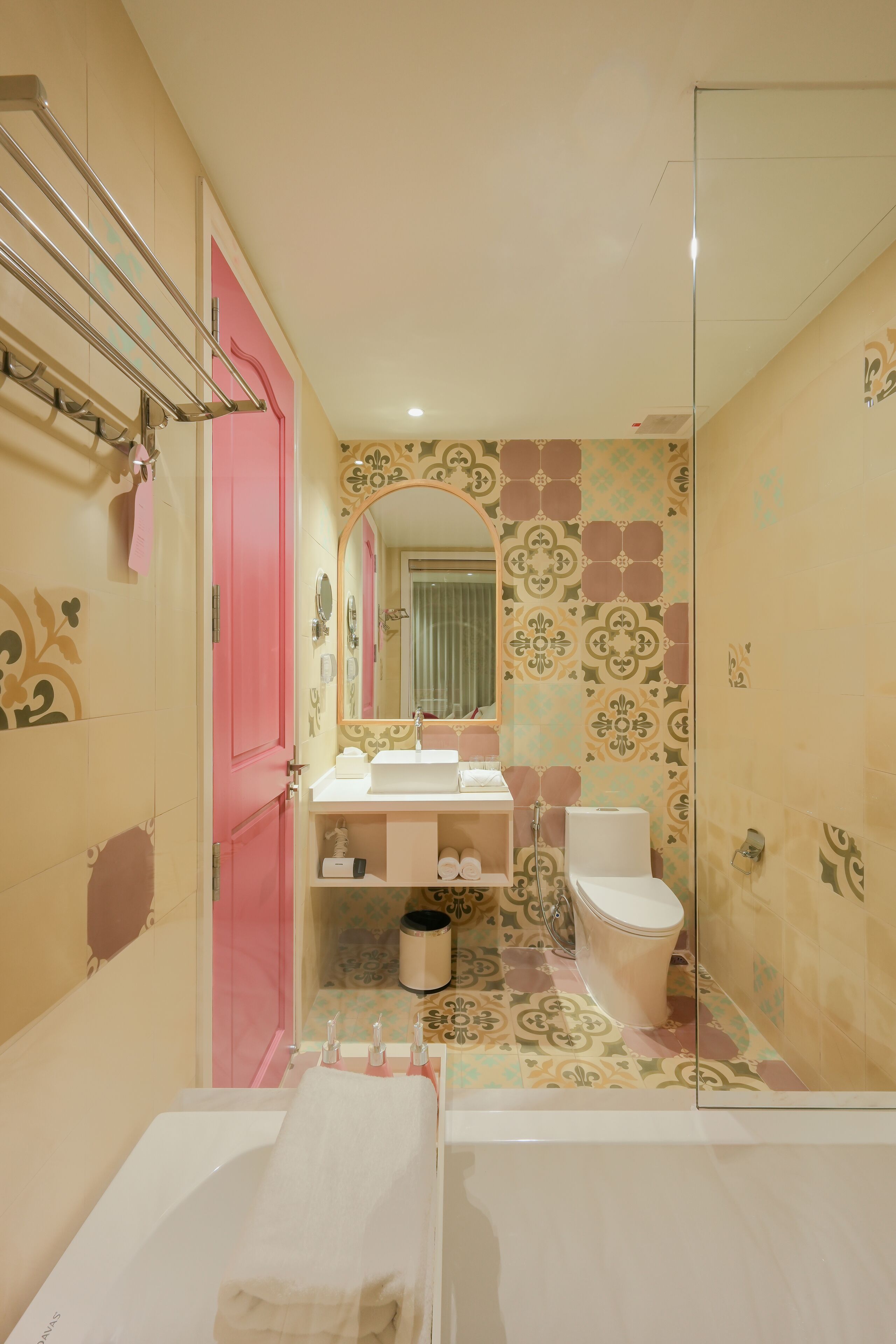 A bathroom with a bathtub, a toilet, and a sink.