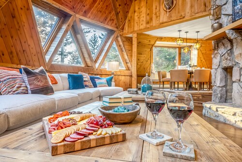 Architectural marvel w/firepit, hot tub, prime location, lounge & bar rooms!