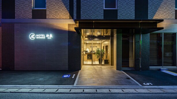 A modern hotel entrance with a sign indicating it is a reference hotel. - Hotel Reference Hakata Reisen (Fukuoka)
