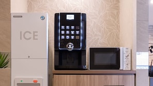 A minibar with a refrigerator, a water dispenser, and a microwave. - Hotel Reference Hakata Reisen (Fukuoka)