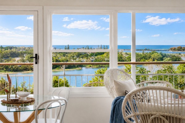 Wake to sparkling Shaws Bay views from your light-filled coastal retreat.