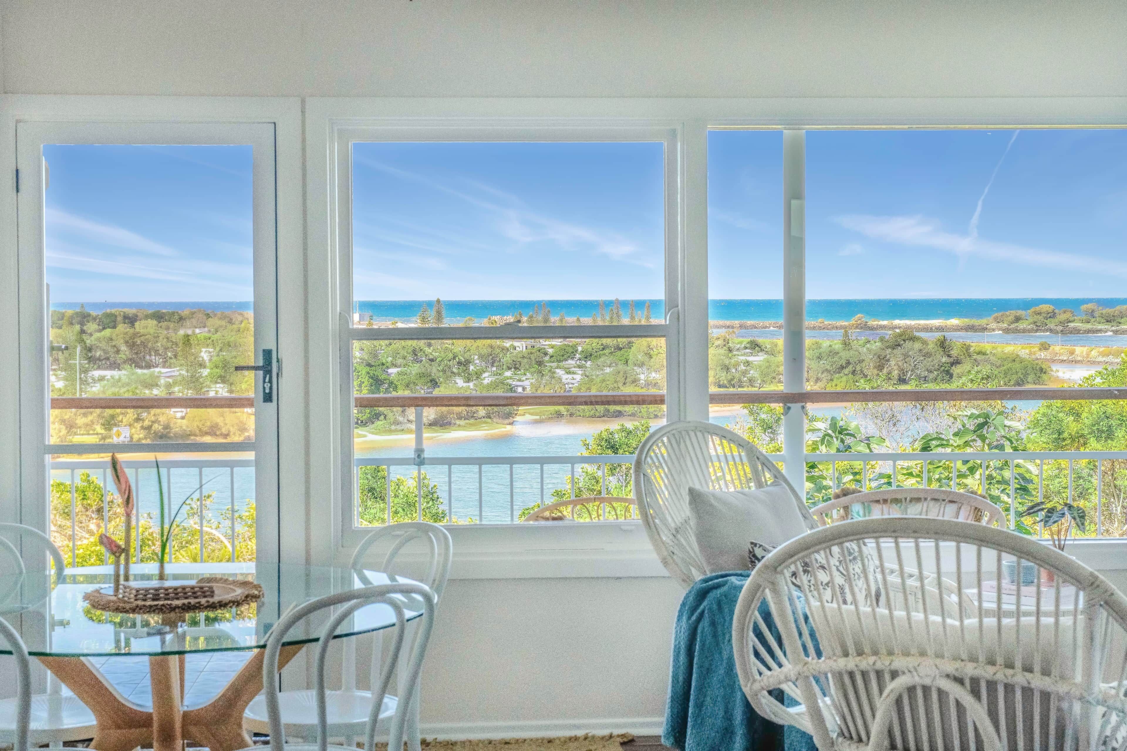 Relax in Seaview's light-filled living area, with sweeping views across Shaws Bay to the Ocean.