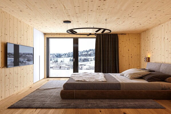 Un dormitorio moderno con un ventanal grande, paredes de madera, un sofá y una televisión.