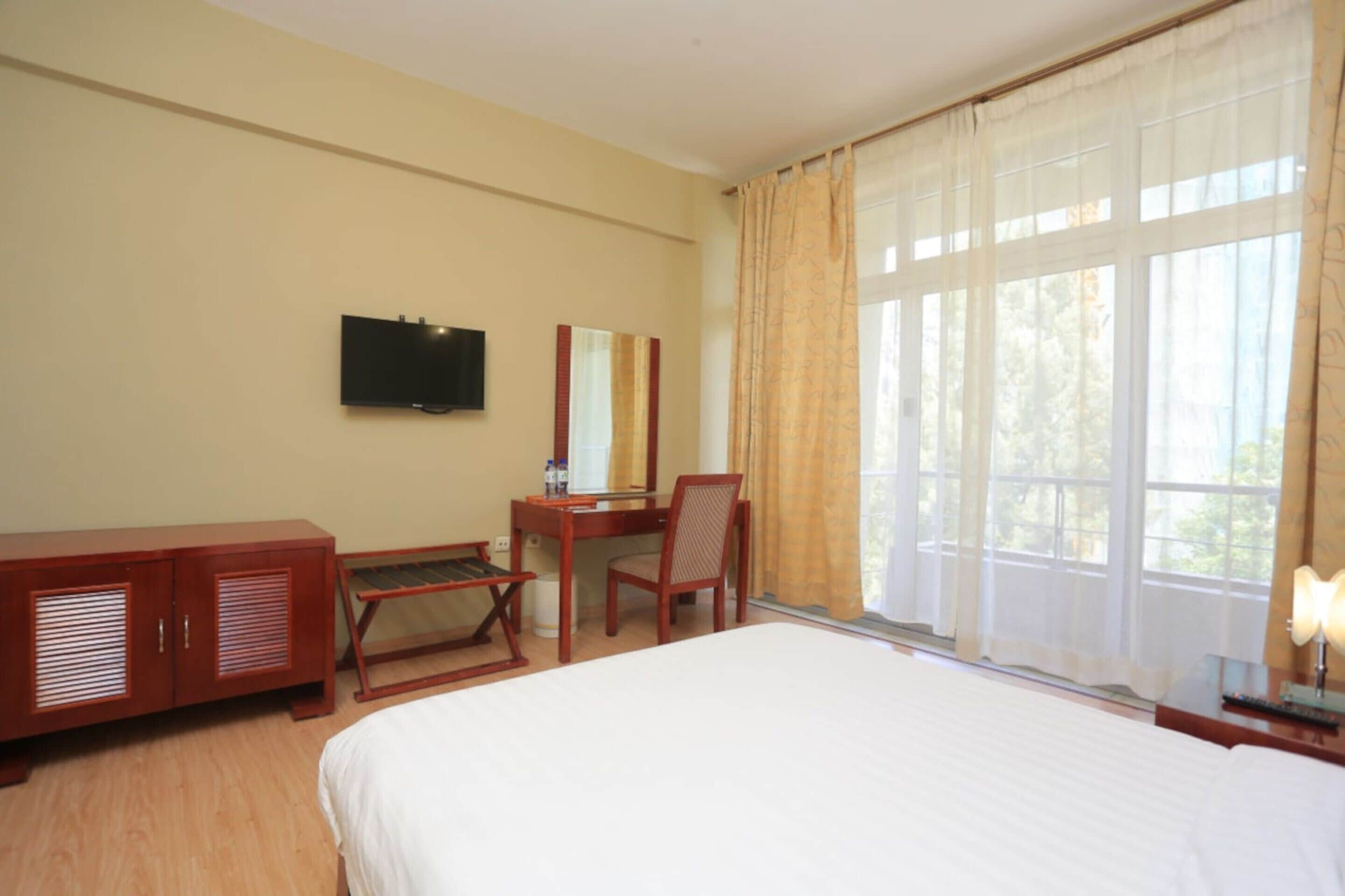 deluxe single room | in-room safe, desk, laptop workspace, iron/ironing board