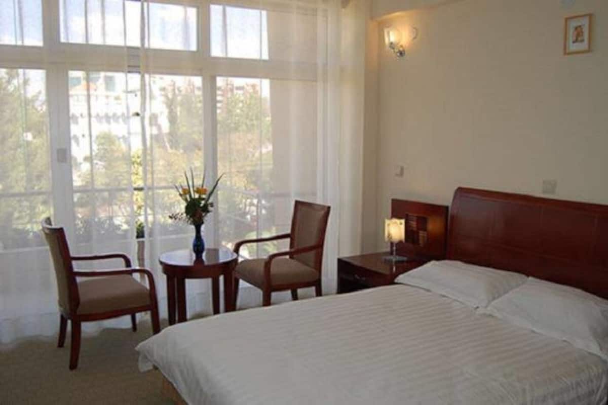 deluxe single room | in-room safe, desk, laptop workspace, iron/ironing board