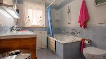 Bathtub, hair dryer, towels