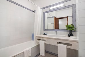 Bathtub, hair dryer, towels