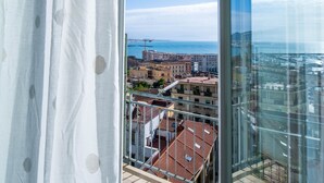 A balcony with a view of a cityscape and the sea. - Panacea (Salerno)