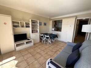 A compact living space with a kitchenette, a dining area, and a seating area with a sofa. - One bedroom apartment in Cannes with a balcony and great sea views. - 821 (Cannes)