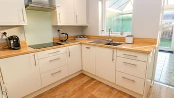 Fridge, electric kettle, toaster, cookware/dishes/utensils