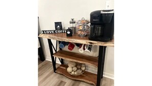 A coffee station with a sign that reads "I LOVE COFFEE," a Keurig coffee maker, a coffee grinder, and a mug rack. - Riverside Riviera at Seminole Heights (Tampa)