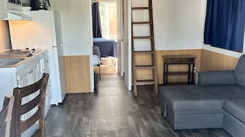 Deluxe Bungalow | Living area | 40-inch flat-screen TV with digital channels, TV, streaming services