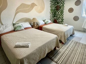 Economy Quadruple Room | Egyptian cotton sheets, premium bedding, down comforters, free WiFi