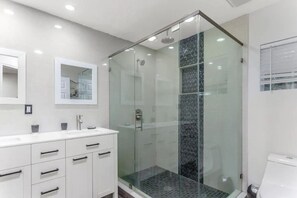 Shower, hair dryer, towels, soap