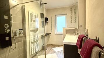 Shower, hair dryer, slippers, towels
