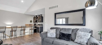 View of Lake Fenton with hot tub and fire place