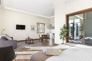 Deluxe Apartment | Living area | 45-inch Smart TV with digital channels, TV, streaming services