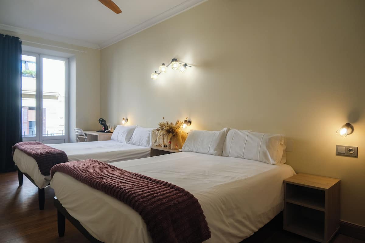 Comfort Quadruple Room | Premium bedding, down comforters, desk, laptop workspace