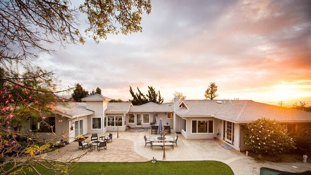 A two-story house with a patio area, a swimming pool, and a well-maintained garden. - Elevate Your Wine Country Escape: Chick-Ranch with Luxurious Amenities, Views, Private Driver (Temecula)