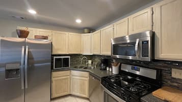 Apartment, 1 King Bed, Hot Tub, Garden View (579 Spindrift Ct Unit B) | Private kitchen | Fridge, microwave, oven, stovetop