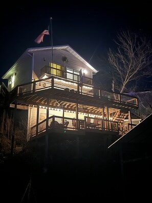 Stunning two-story residence with a spacious balcony and central entrance.