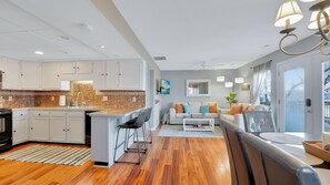 Enjoy a comfortable stay in this apartment with a spacious living area, dining table, and fully equipped kitchen.