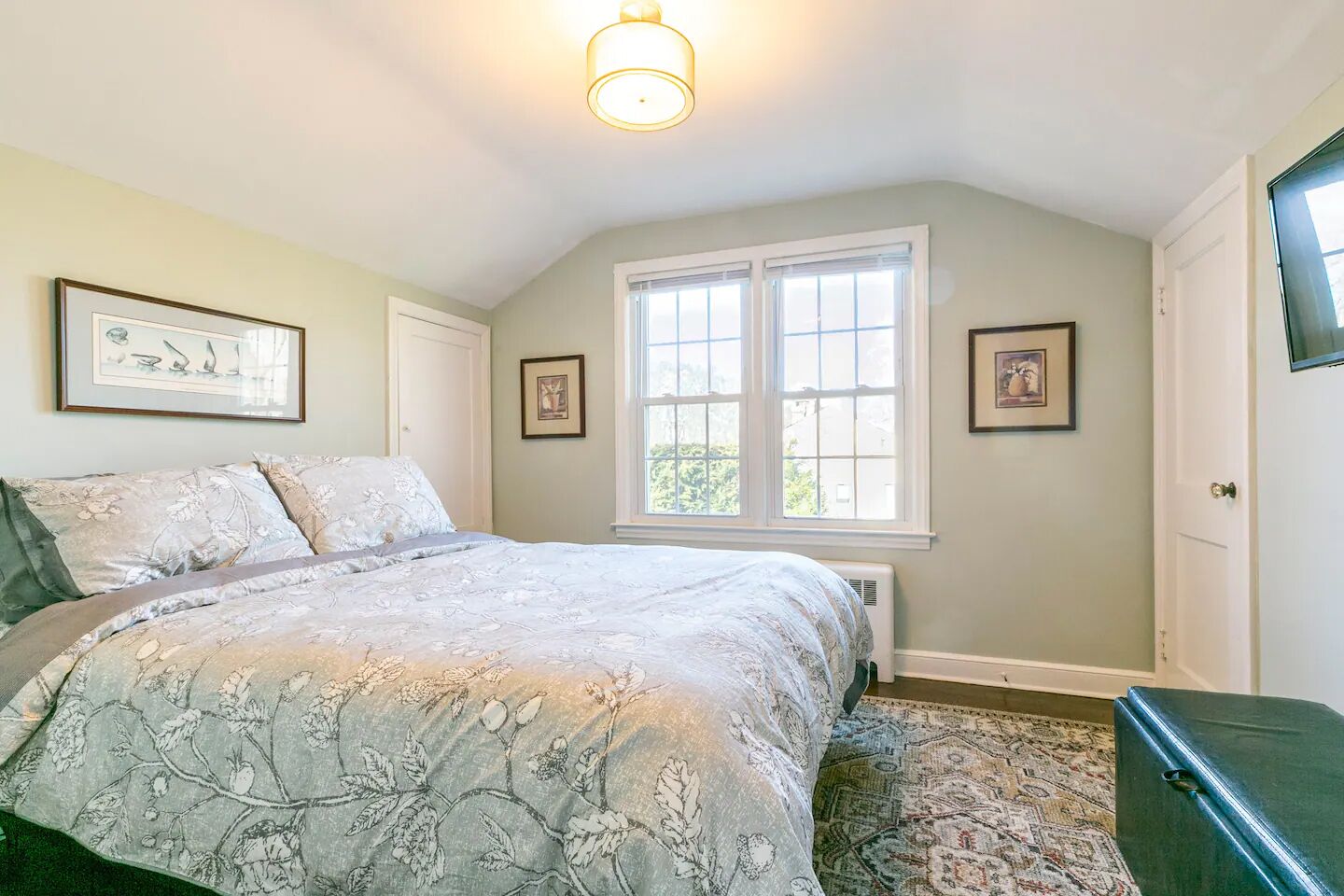 Bedroom 3: Queen bed, nightstand, smart TV and closet storage (no dresser here).