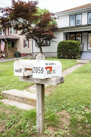 A wooden mailbox with a house number 2059 and the text "FIRST FL." in the background. - ❤Beautifully Renovated Lancaster Apt❤ (Lancaster)