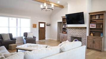 Smart TV, fireplace, books, video library