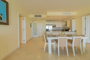 Enjoy meals in this spacious dining area with a large table and six chairs.