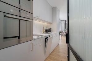 Apartment, 2 Bedrooms, 2 Bathrooms | Private kitchen | Microwave, dishwasher, coffee/tea maker, cookware/dishes/utensils
