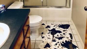 Bathtub, hair dryer, towels