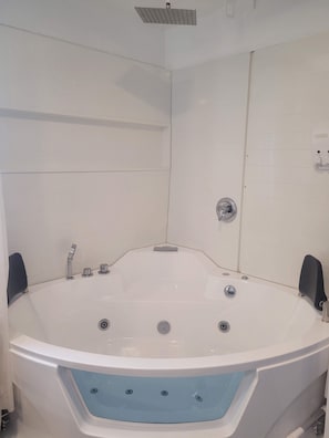 Jetted tub, hair dryer, towels, soap