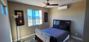 1 bedroom, desk, iron/ironing board, travel crib