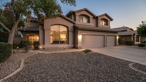 Front of property - evening/night - Massive 5 Bdrm Getaway W/pool, Hot Tub, Game Room! (Gilbert)