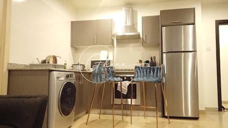 Luxury Apartment | Private kitchen | Full-size fridge, microwave, oven, stovetop