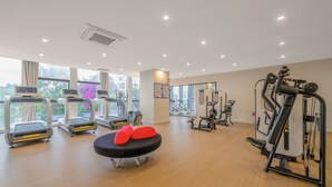 A gym with treadmills, a stationary bike, and various exercise machines. - Holiday Inn Express Kunming Panlong by IHG (Kunming)