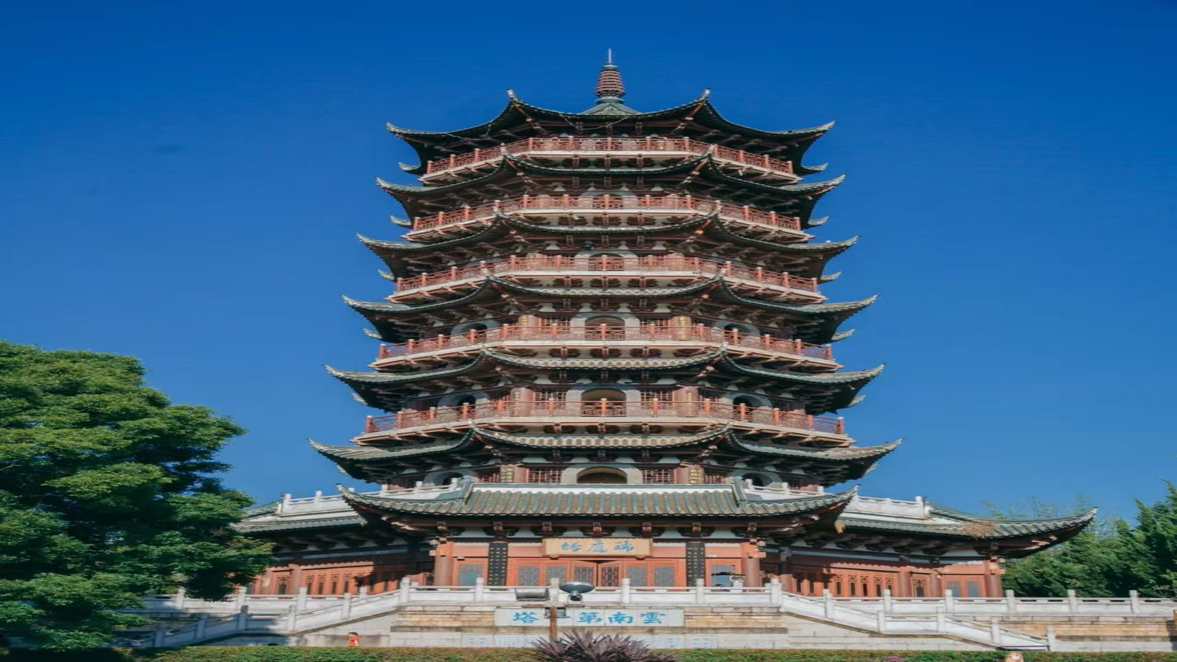 A multi-tiered pagoda-style building with a traditional architectural design, featuring multiple eaves and a central spire.