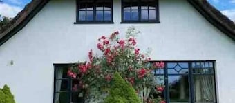 Thatched cottage with large garden and fireplace
